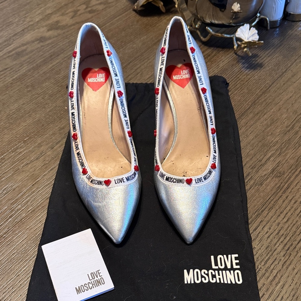 Love Moschino Metallic Silver Pointed Toe Pumps with Heart Trim